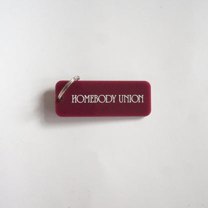 Homebody Union rectangular acrylic keyring with logo

